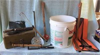 Old ice fishing supplies - poles, ice scooper,