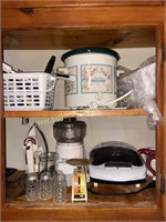 Cabinet of small kitchen appliances and utensils,