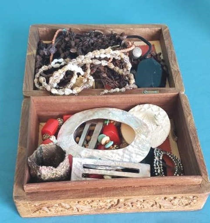 Carved wood jewelry box with costume jewelry