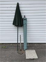 2 outdoor umbrellas and 2 umbrella stands 1 is