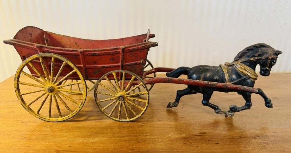 Antique cast-iron horse drawn wagon