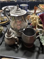 Pewter pitcher, teapot, creamer and plates.