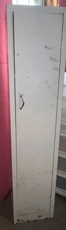 Metal storage locker/ damaged on back