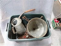 assortment of funnels, oil cans, tire irons