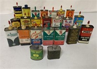 23 mostly oil and lighter fluid tins