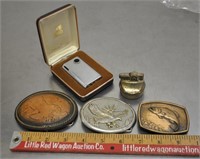 Belt buckles & lighters, see pics