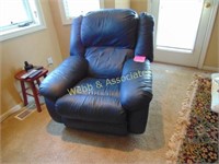 Blue leather recliner, shows wear