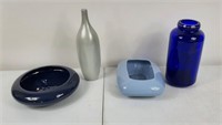 Assortment of blue and silver vases