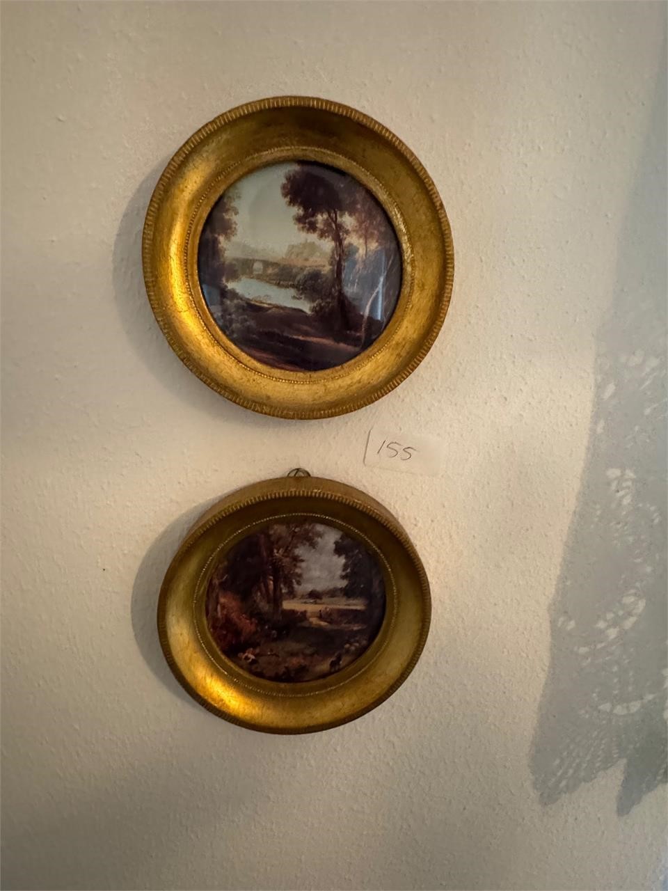 2 CIRCLE FRAMED PICTURES