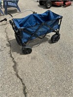 Ozark trail folding four wheeled blue wagon