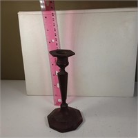 Brass candlestick appears red