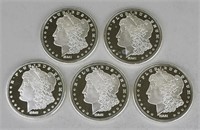 5 One Troy Ounce Fine Silver Morgan Coins.