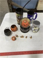 Halloween decorations, cups, jar of eye balls,