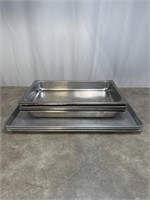 Large metal cookie sheets, 26 inches long. Metal