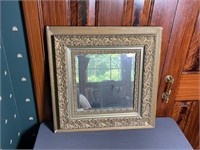Gold framed antique wall mirror