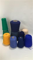 9 Spools Of Yarn of different Colors