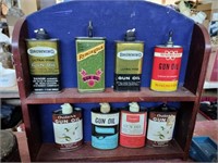 Wooden shelf display gun oil containers