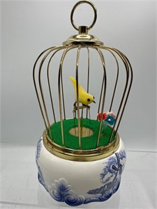 Vintage musical dancing bird in cage