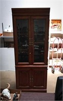 Illuminated hutch with glass doors and a