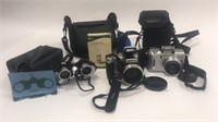 Lot of 2 Digital Cameras and 1 Set of Binoculars