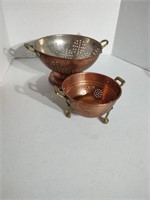 Copper strainers with brass handles, not marked.