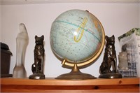 books, book ends, globes, Virgin Mary, alarm bell