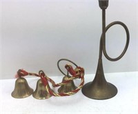 Brass bells and a brass trumpet candlestick