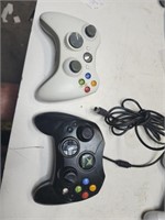 Xbox 360 controllers,  one corded, one wireless.