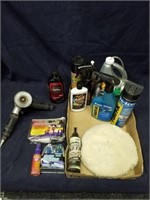 Assortment of automotive detailing supplies with