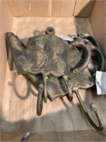Five cast iron teapot coat hooks. 7 inches wide 6