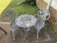 2 metal chairs, table