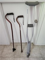 2 cane's and a pair of crutches