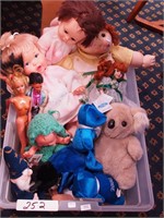 Container of dolls and plush animals including