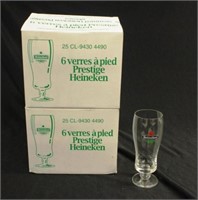 Twenty four Heineken stemmed beer glasses