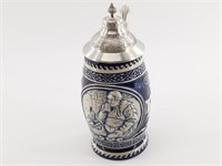 Germen beer stein with blue and white base. Potter
