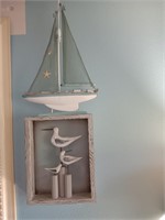 Wood shadow box with birds and a sailboat.