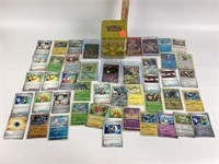 Pokémon cards (45) in sleeves, tin