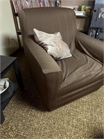 large lounge chair and throw pillow