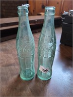 2 old tall coke bottles 1 made in Corinth, Miss