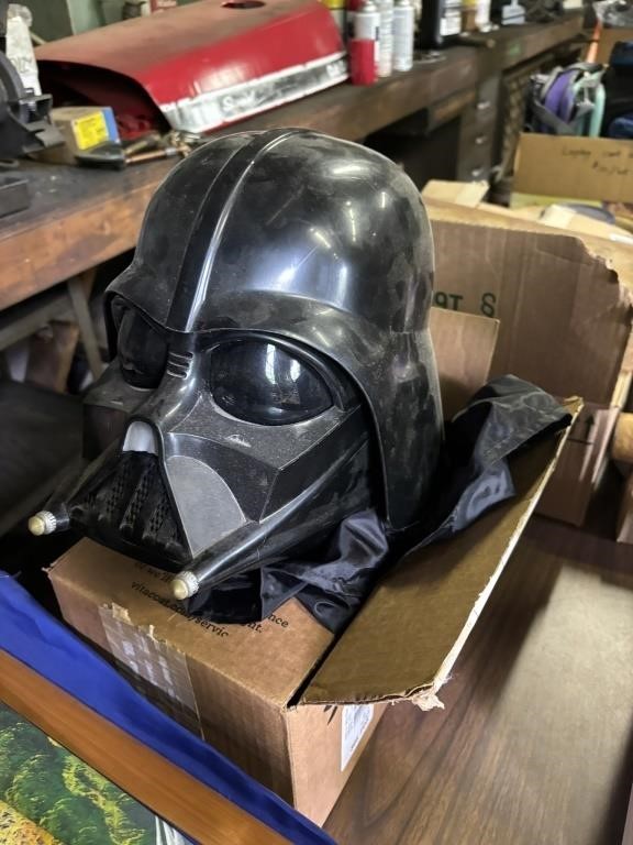 darth vador costume wih helmet and sword in