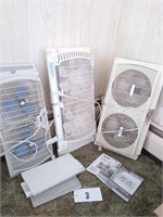 Lot of three window fans and accessories