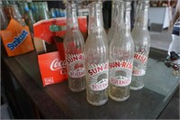Sunrise Glass Bottles in Coca Cola Paper Holder