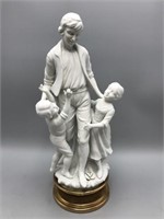 Parian statue of father and children