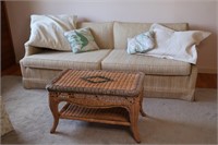 Couch, Throw Pillows and Wicker Side Table