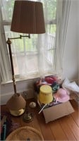 Brass floor lamp with a swing arm, brass table,
