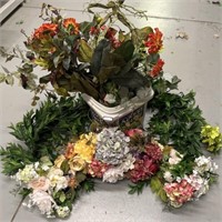 Various orange and green floral stems and garland