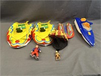 3 INFLATABLE TOY BOATS, 1 TOY BOAT, 1 MAN, 1