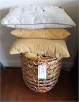 Contemporary basket full of pillows and throws