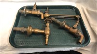 Antique brass beer taps and thermometer