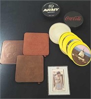 Souvenir hockey pucks, leather coasters, round